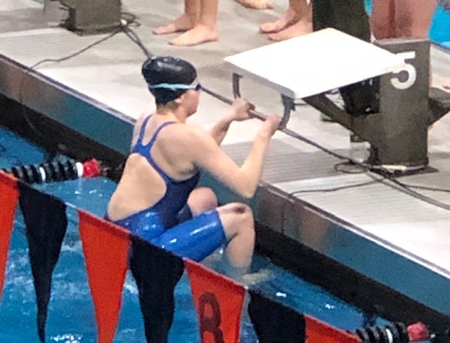 RCS Senior Megan Buzas competing in swimming event.