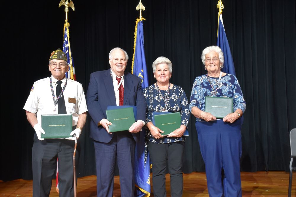 Veterans & their Families with Diplomas at Operation Recognition Ceremony